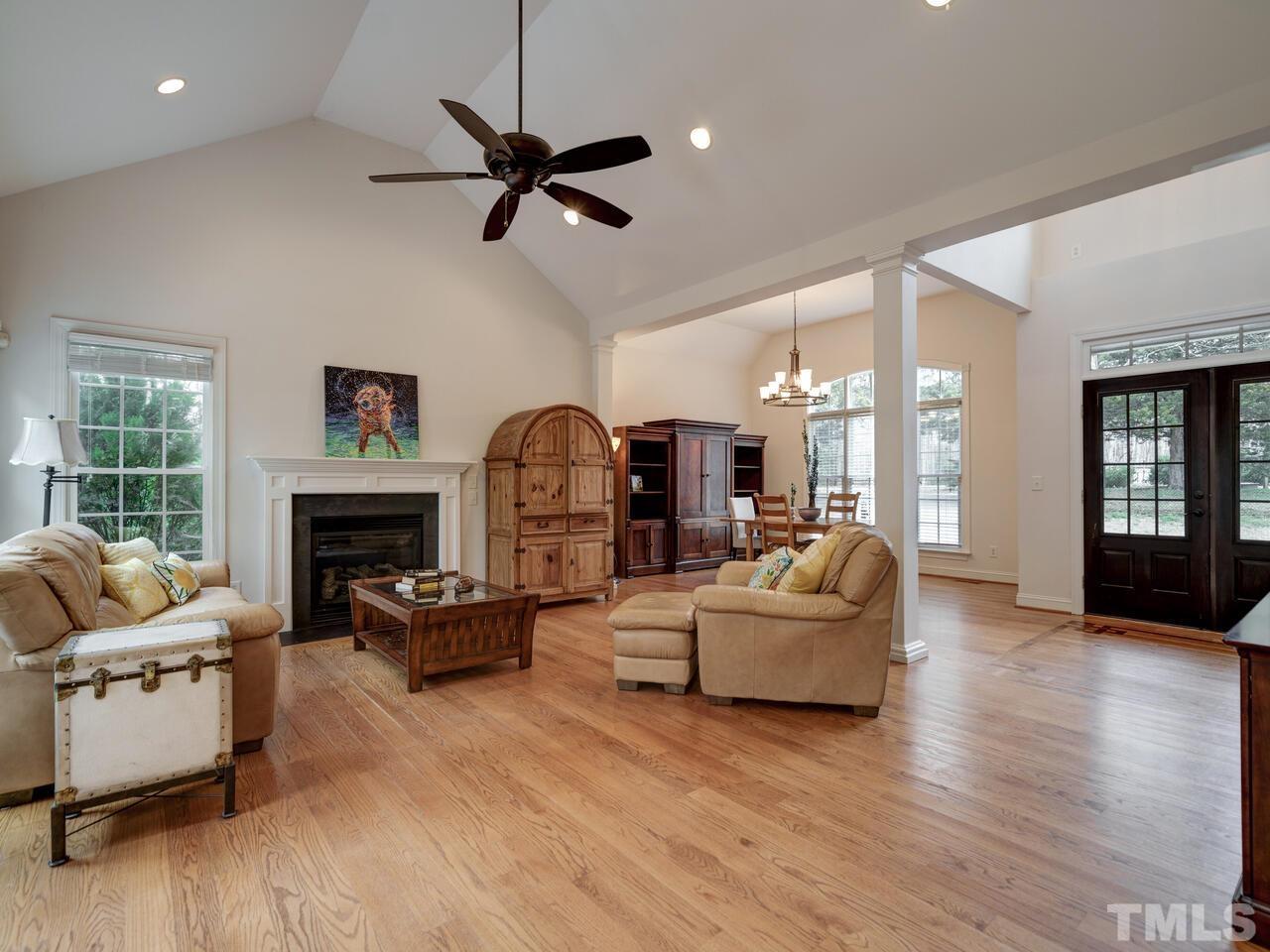 361 Sandy Point Drive Manson, NC 27553 - Photo 12 of 49 a living room with furniture a fireplace and a large window