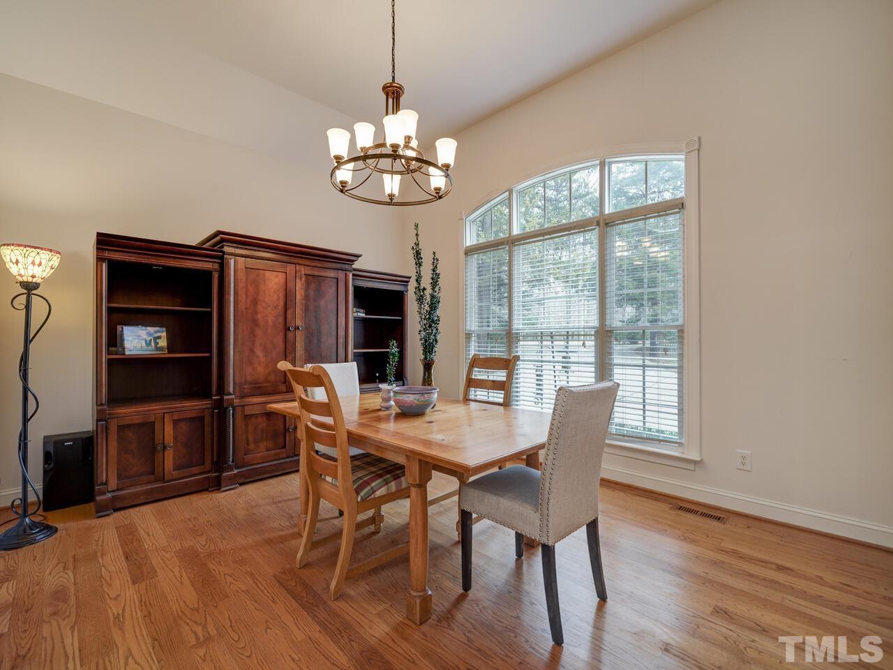 361 Sandy Point Drive Manson, NC 27553 - Photo 15 of 49 a view of a dining room with furniture wooden floor and chandelier