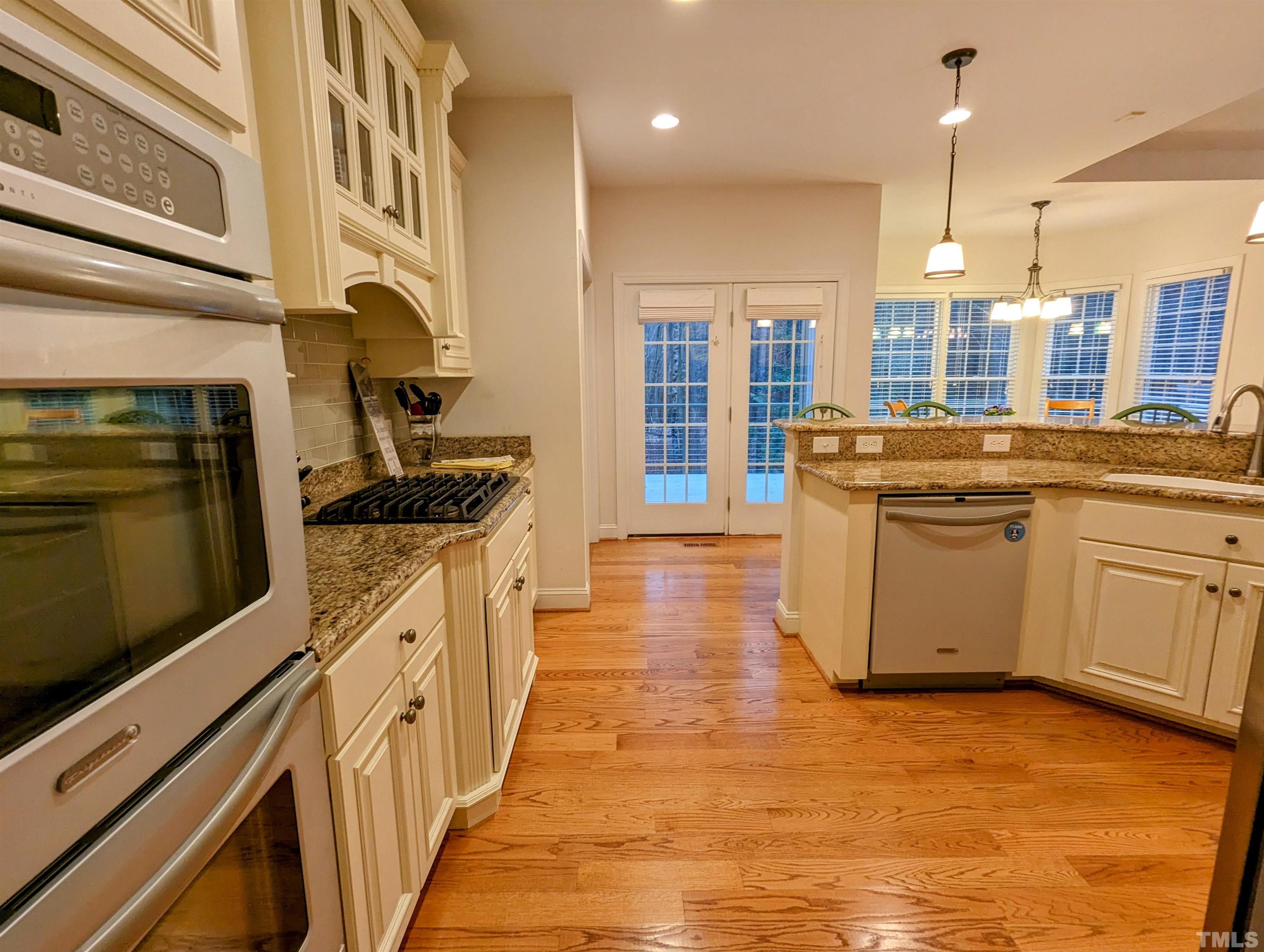 361 Sandy Point Drive Manson, NC 27553 - Photo 24 of 49 a kitchen with stainless steel appliances granite countertop a stove and a sink