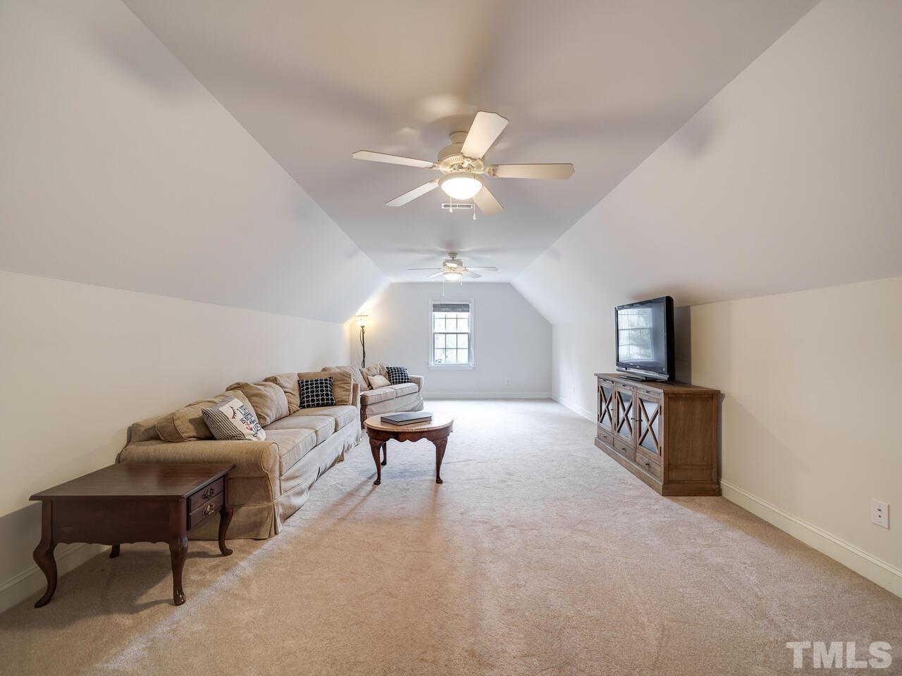 361 Sandy Point Drive Manson, NC 27553 - Photo 32 of 49 a living room with furniture and a flat screen tv