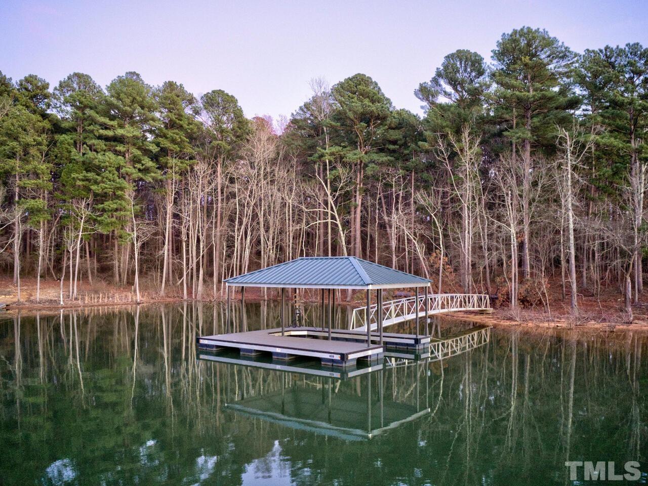 361 Sandy Point Drive Manson, NC 27553 - Photo 45 of 49 a swimming pool with outdoor seating and yard