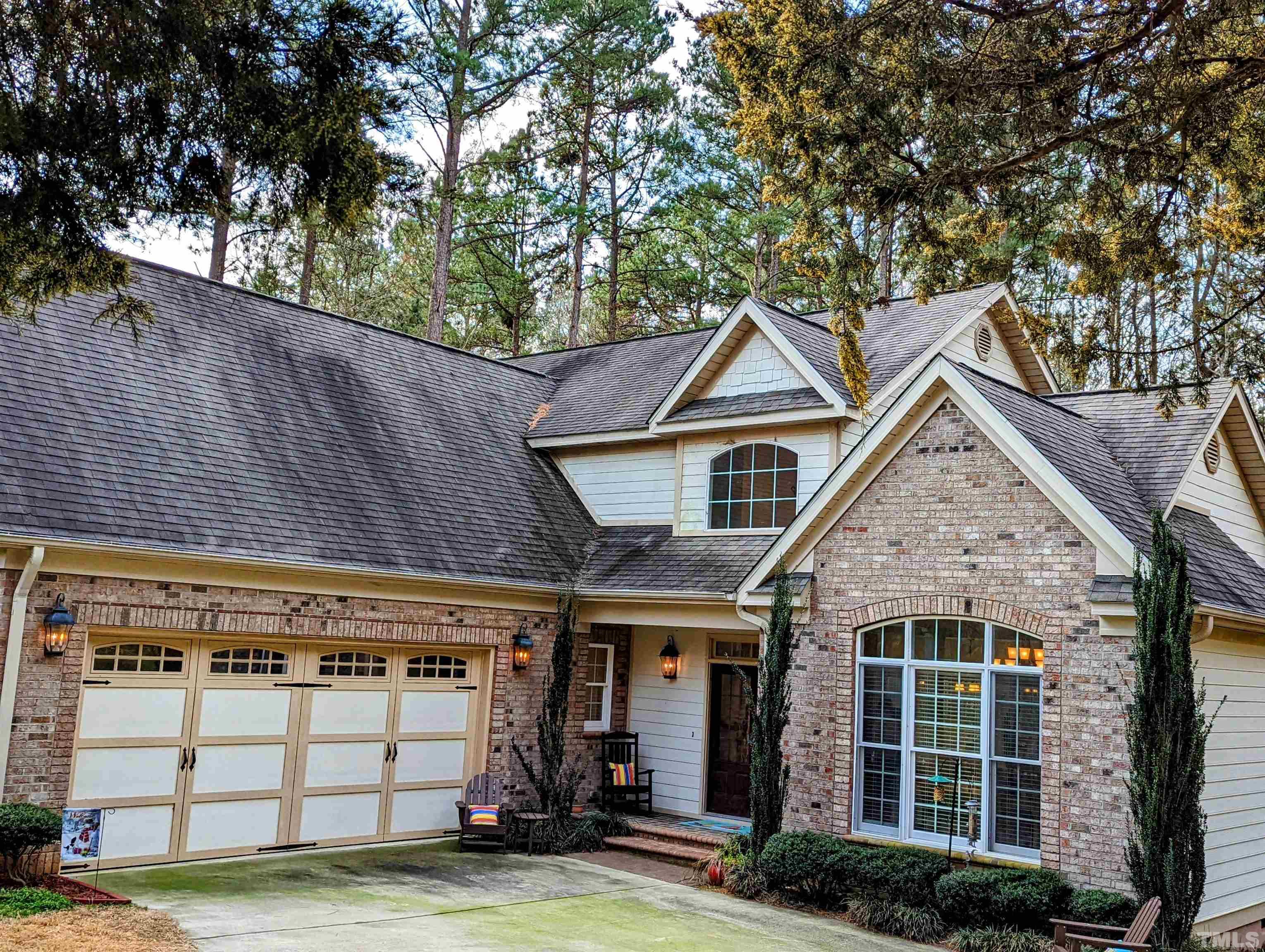 361 Sandy Point Drive Manson, NC 27553 - Photo 46 of 49 a view of a house with a yard and plants