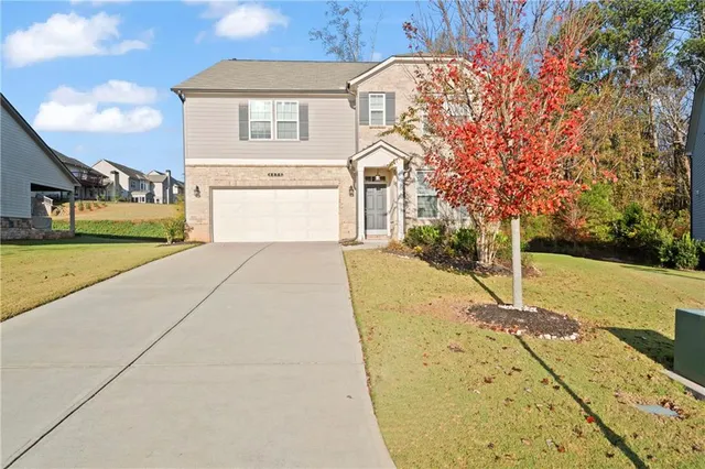 a view of a house with basketball court
