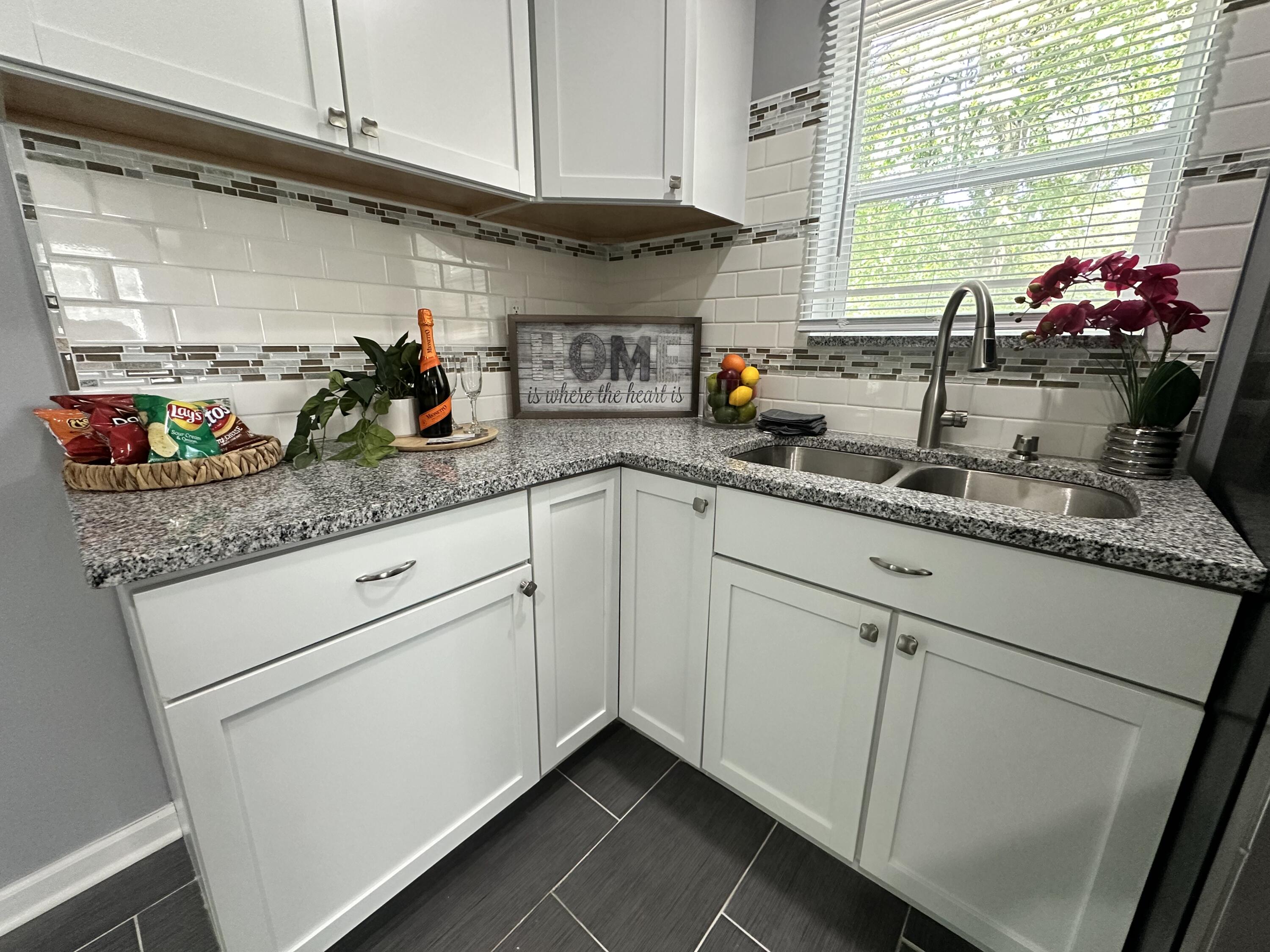 2120 Crest Road Gary, IN 46408 - Photo 54 of 62 a kitchen with stainless steel appliances white cabinets and a sink