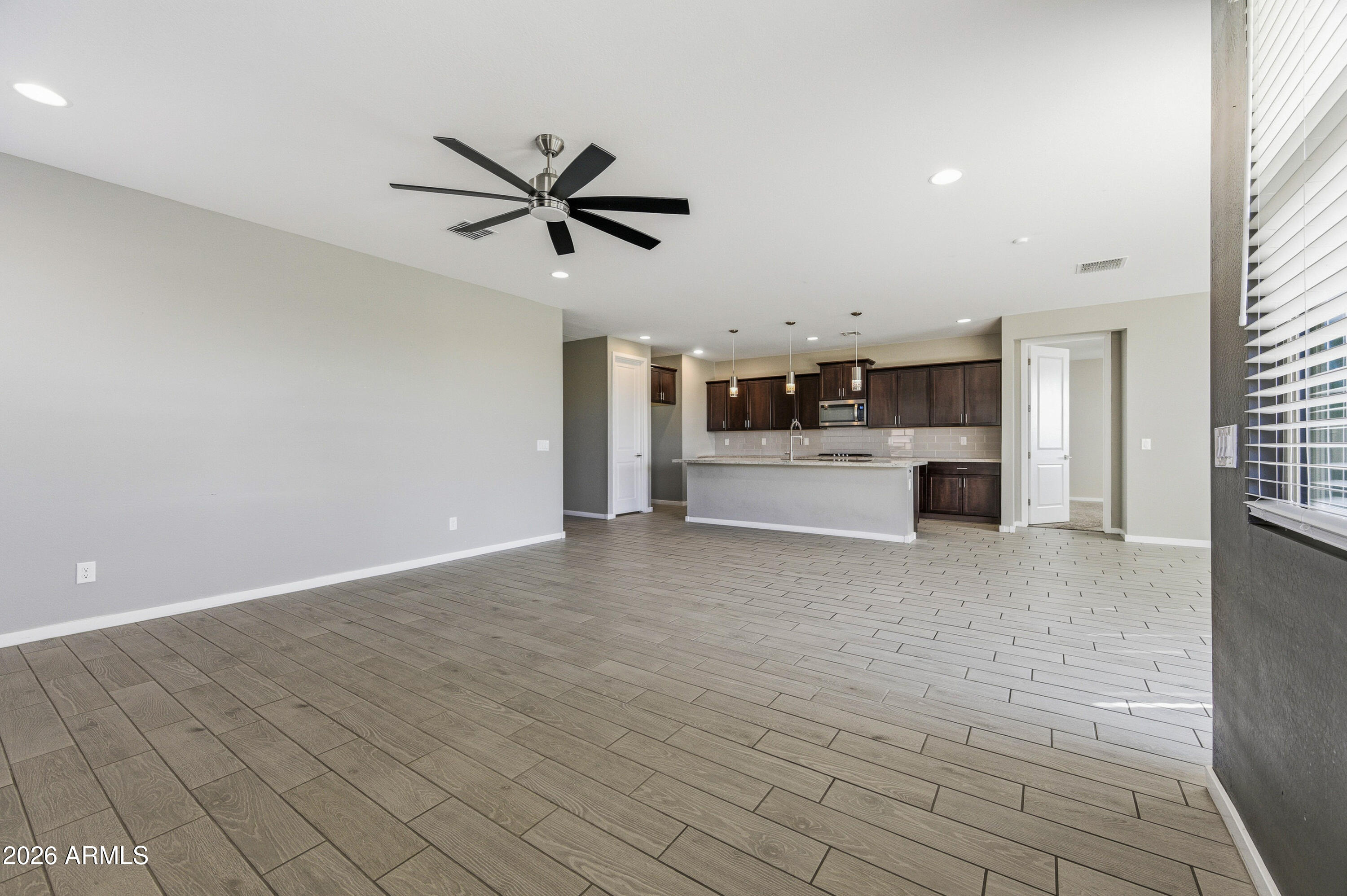 18225 West Pierson Street Goodyear, AZ 85395 - Photo 14 of 39 a view of a kitchen with a sink and a refrigerator