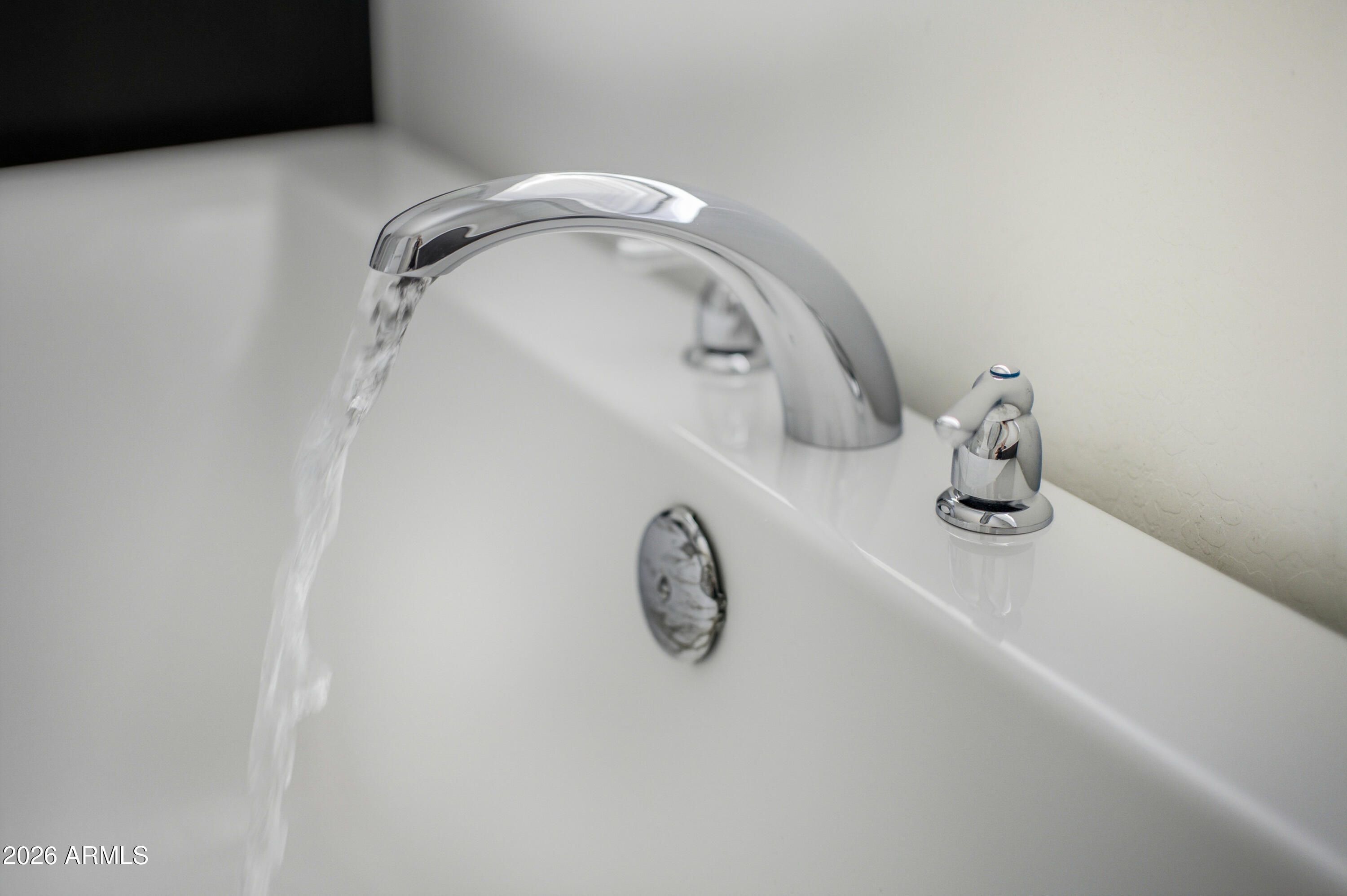 18225 West Pierson Street Goodyear, AZ 85395 - Photo 25 of 39 a bathroom with a granite countertop sink and vanity