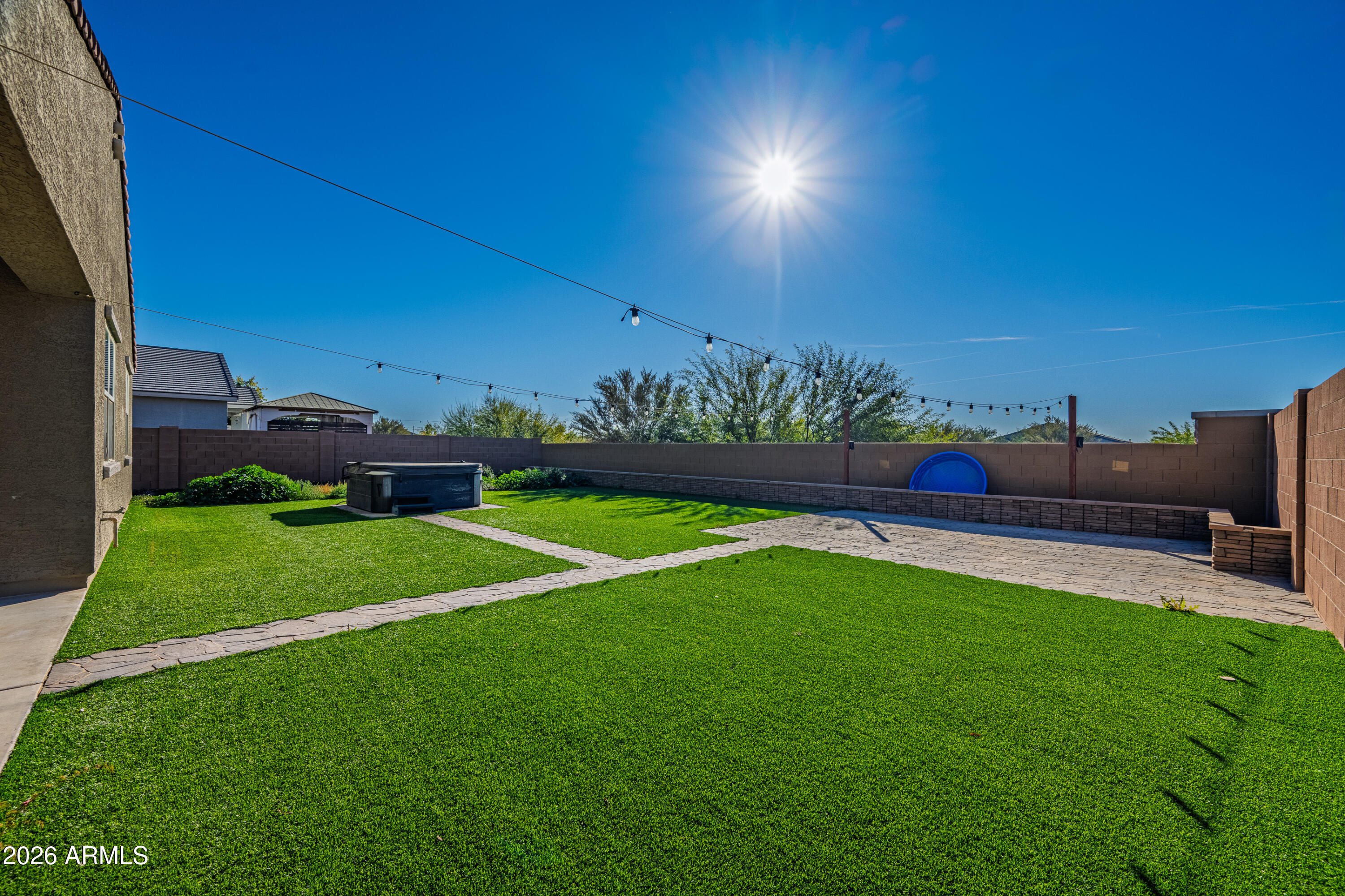 18225 West Pierson Street Goodyear, AZ 85395 - Photo 34 of 39 a view of a garden with a building in the background