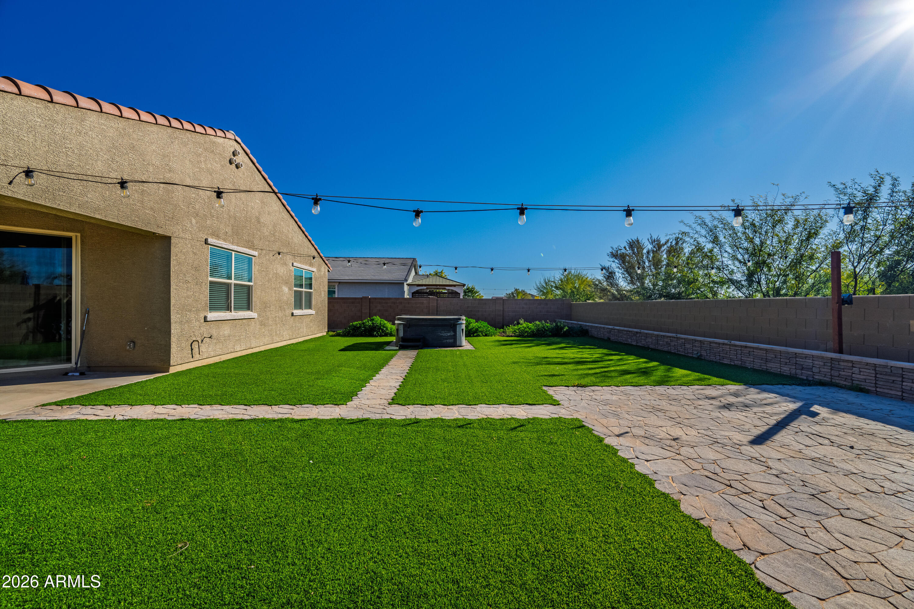 18225 West Pierson Street Goodyear, AZ 85395 - Photo 38 of 39 a view of backyard with plants and outdoor seating