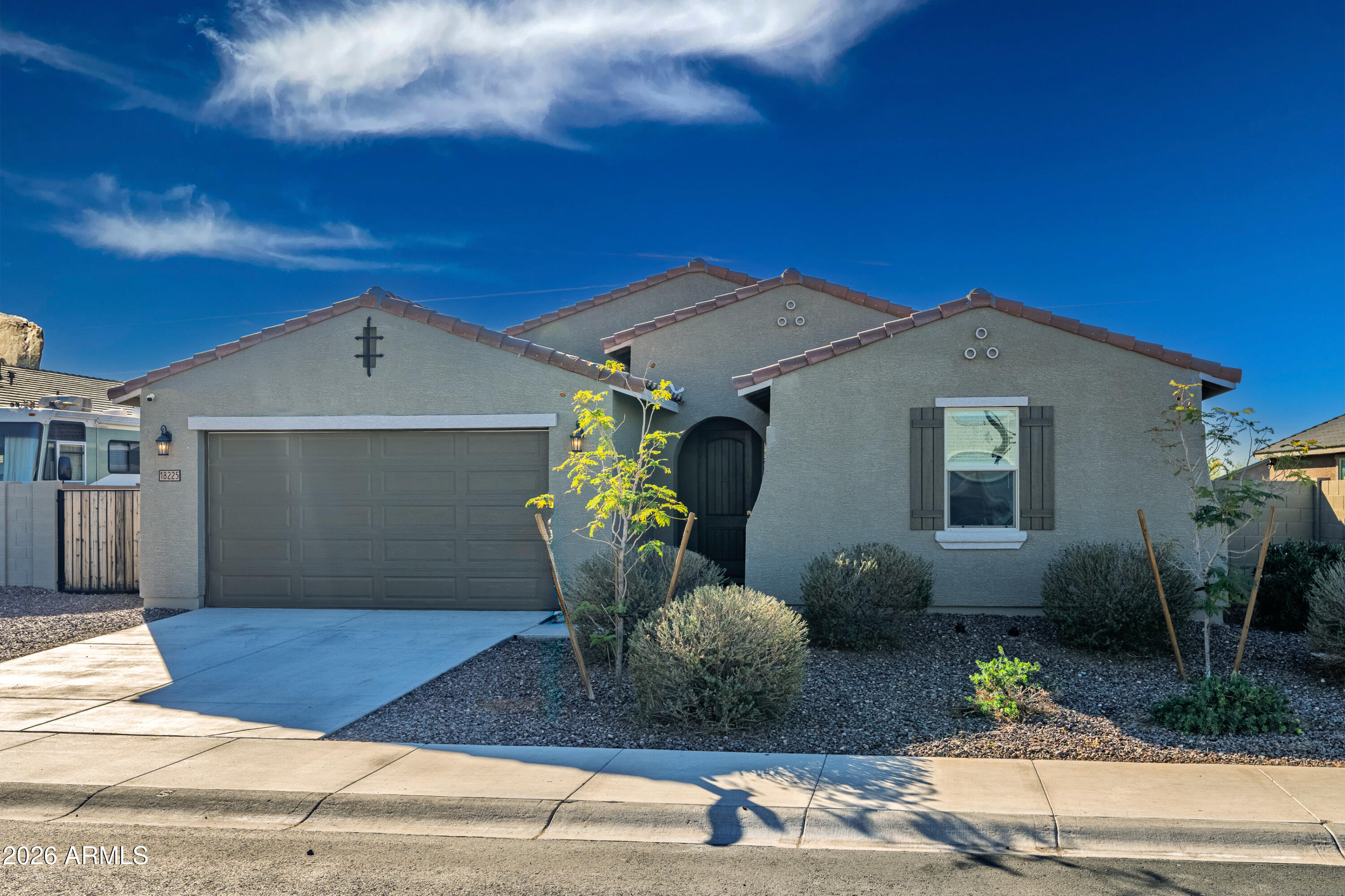 18225 West Pierson Street Goodyear, AZ 85395 - Photo 4 of 39 a front view of a house with garden