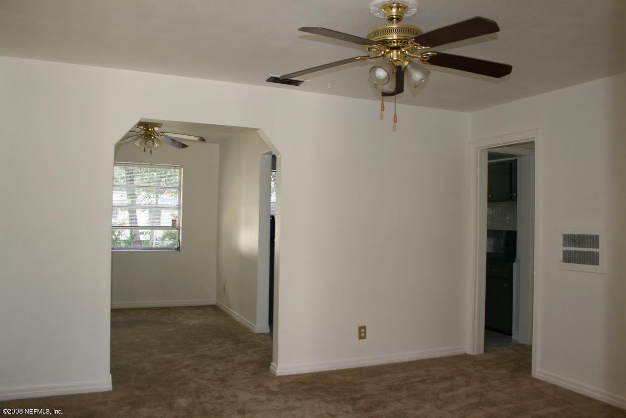2705 Lorna Road Jacksonville, FL 32211 - Photo 13 of 18 an empty room with windows and fan