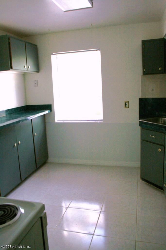 2705 Lorna Road Jacksonville, FL 32211 - Photo 4 of 18 a kitchen with a sink and a stove
