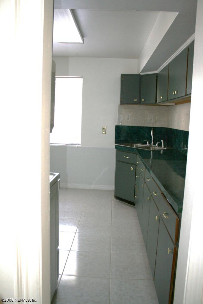 2705 Lorna Road Jacksonville, FL 32211 - Photo 5 of 18 a kitchen with a sink and cabinets