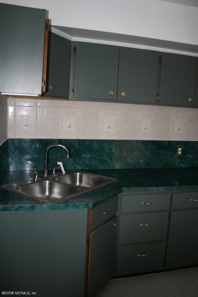 2705 Lorna Road Jacksonville, FL 32211 - Photo 6 of 18 a kitchen with a sink and cabinets