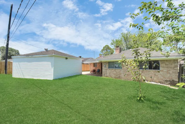 a view of a house with a back yard