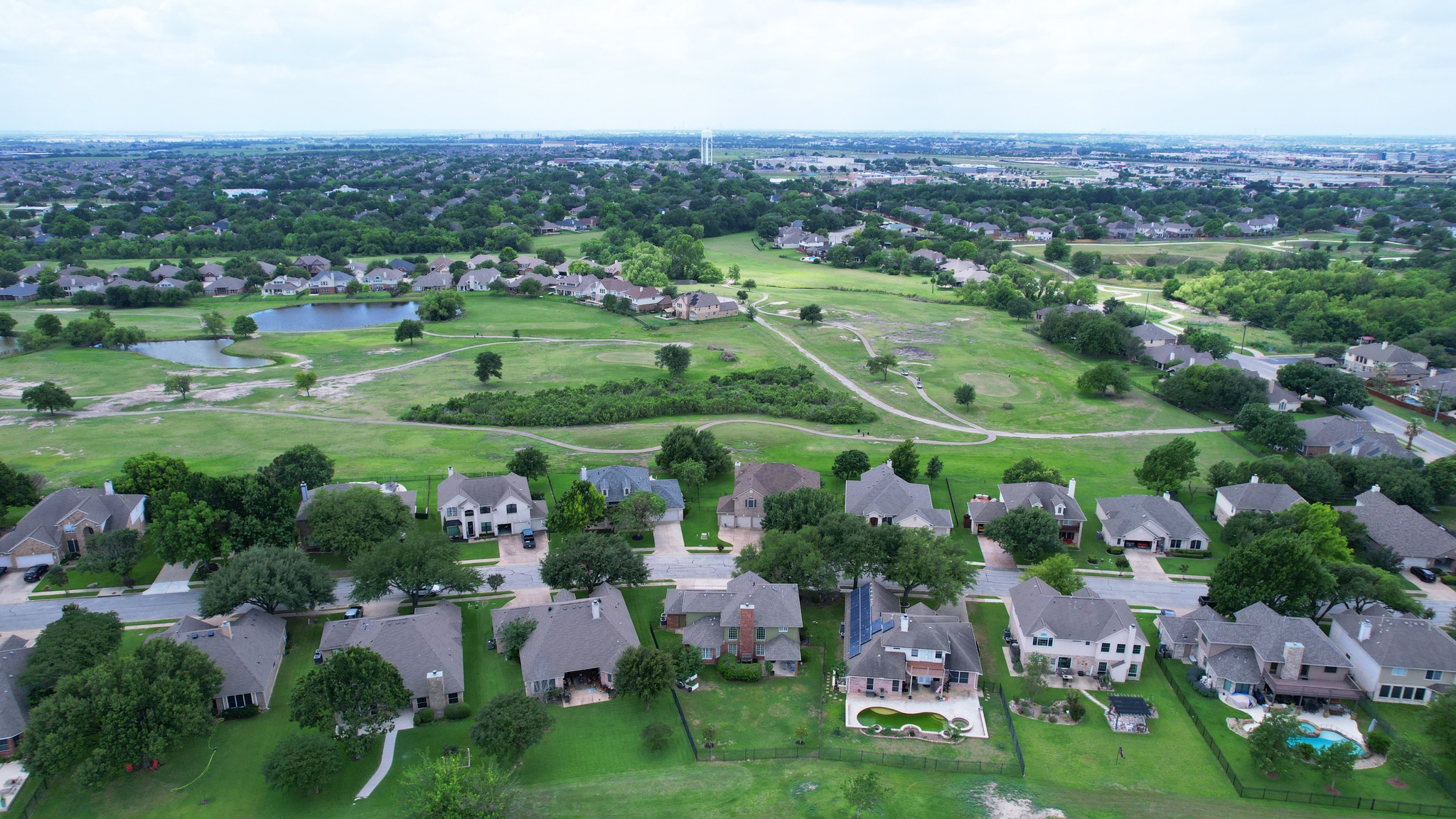 2408 Amen Corner Road Pflugerville, TX 78660 - Photo 40 of 40 Aerial perspective showcasing a residential area with varied architectural styles