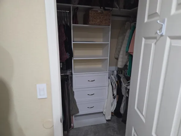 a bathroom with a shower and a sink