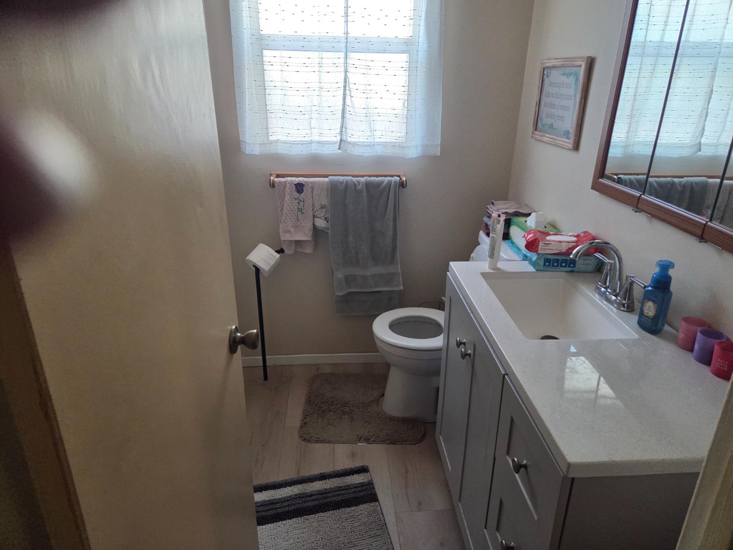 1404 Solar Avenue Modesto, CA 95351 - Photo 17 of 28 a bathroom with a sink toilet and a mirror