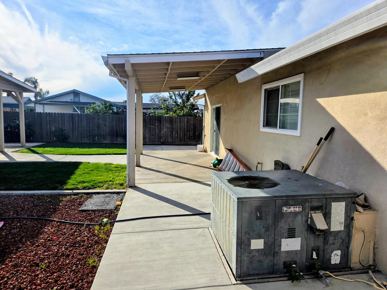 1404 Solar Avenue Modesto, CA 95351 - Photo 21 of 28 a front view of a house with garden