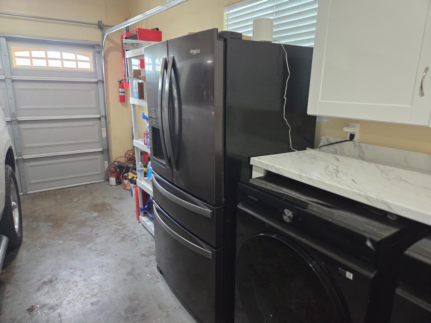 1404 Solar Avenue Modesto, CA 95351 - Photo 28 of 28 a kitchen with a refrigerator and countertop