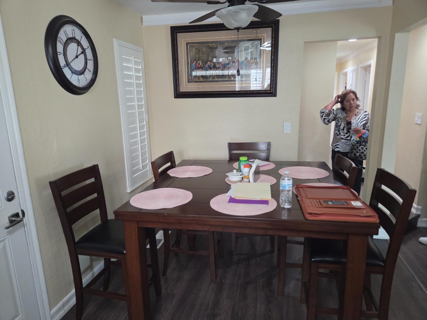 1404 Solar Avenue Modesto, CA 95351 - Photo 7 of 28 a view of a dining room with furniture and wall paintings