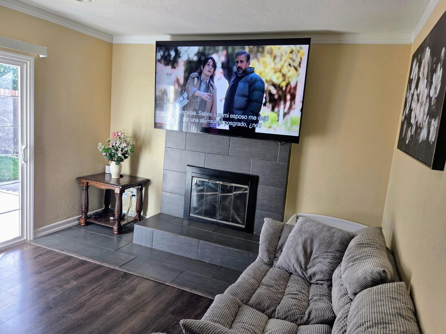 1404 Solar Avenue Modesto, CA 95351 - Photo 9 of 28 a living room with furniture and a fireplace
