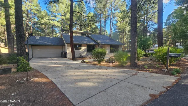 a view of a house with a tree s