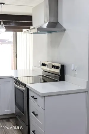 a kitchen with a stove and a microwave
