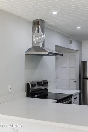 a kitchen with a refrigerator and a sink