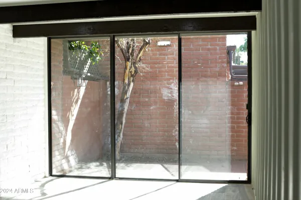 a bathroom with a glass shower door