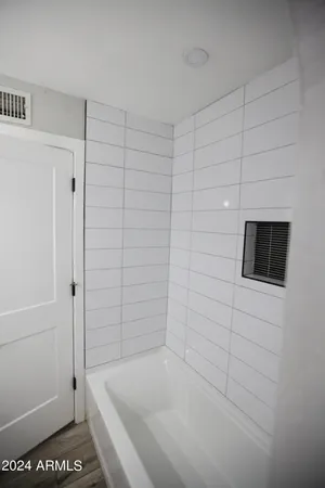 a bathroom with a shower and a bathtub