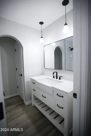 a bathroom with a sink and a mirror