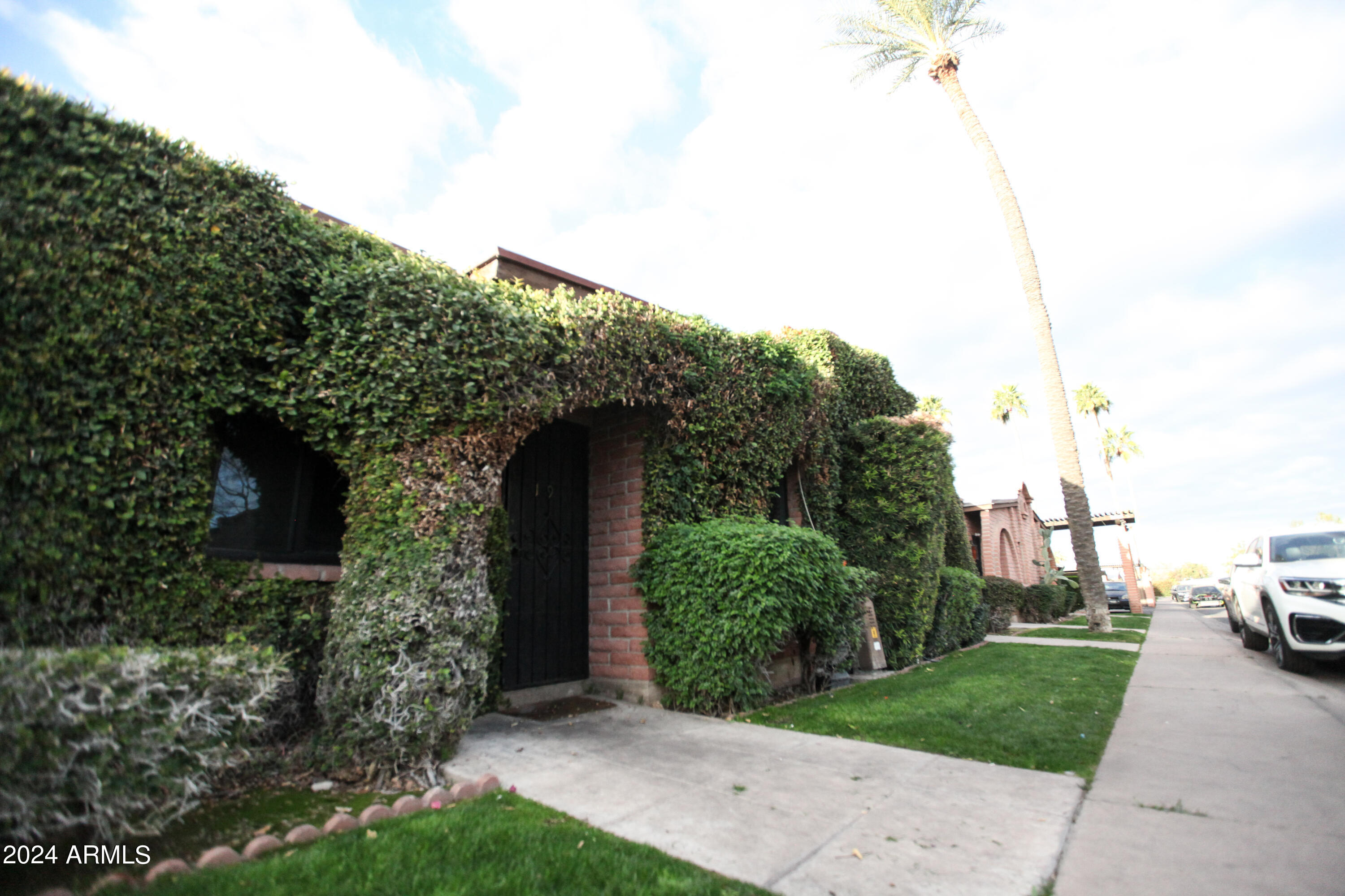 3002 North 32nd Street, Unit 19 Phoenix, AZ 85018 - Photo 3 of 26 a view of a house with a backyard