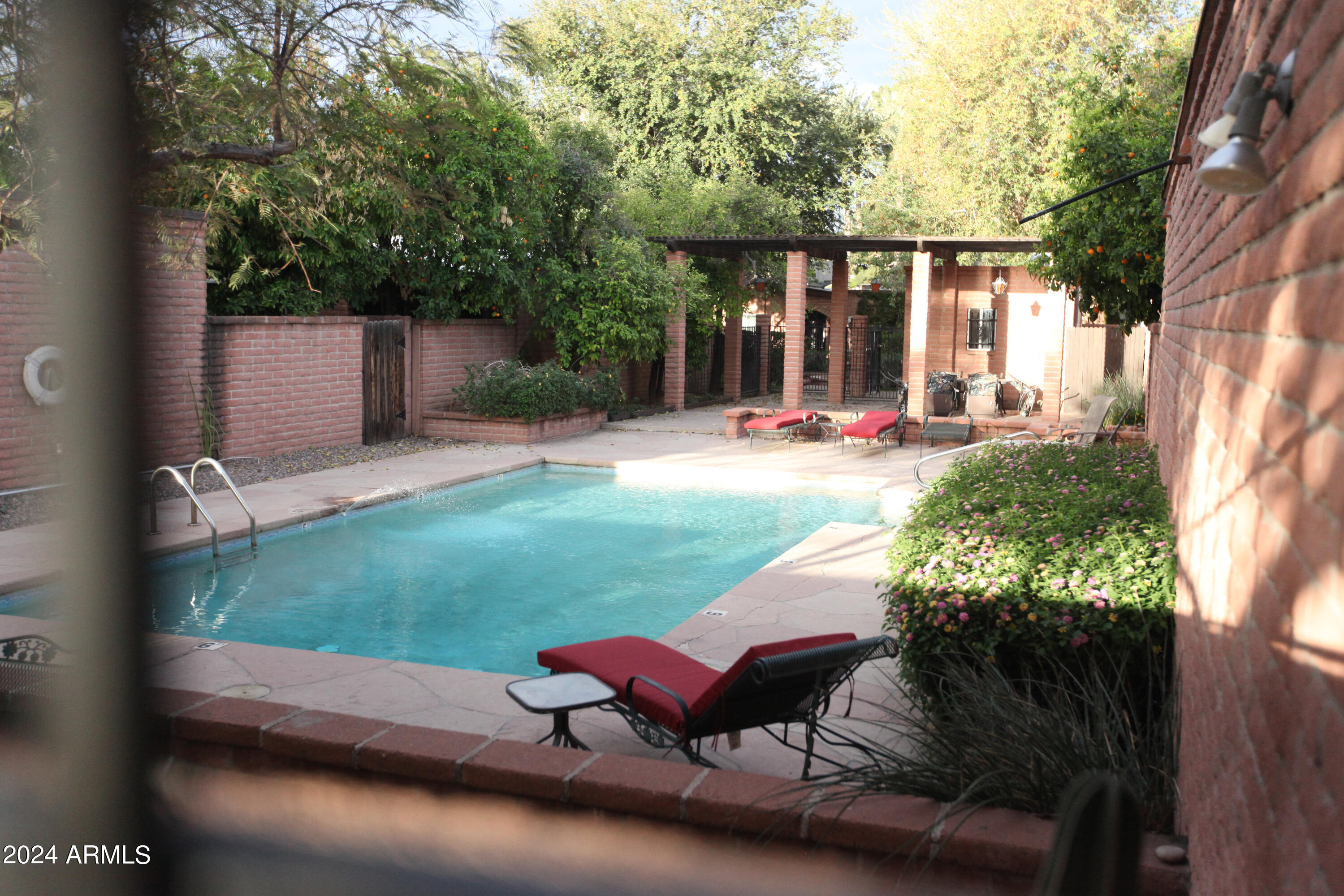 3002 North 32nd Street, Unit 19 Phoenix, AZ 85018 - Photo 6 of 26 a backyard of a house with outdoor seating
