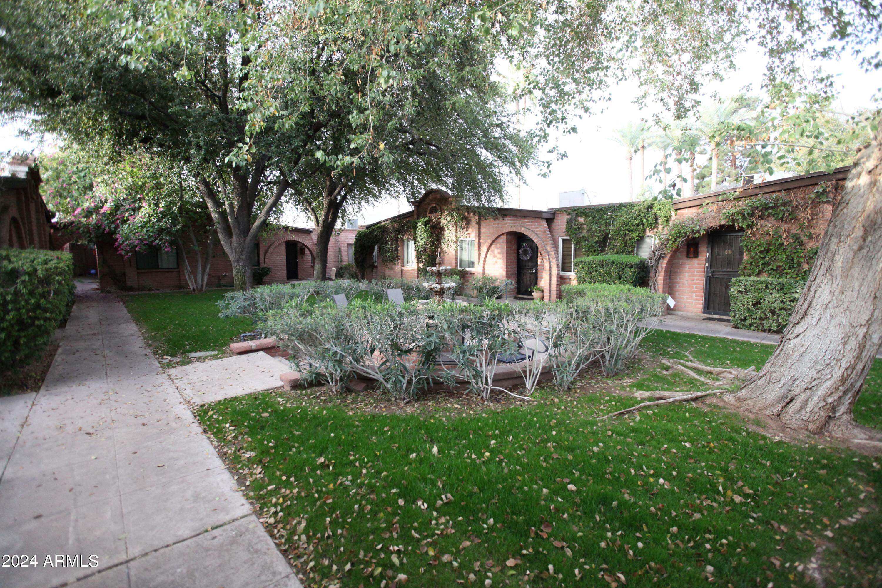 3002 North 32nd Street, Unit 19 Phoenix, AZ 85018 - Photo 8 of 26 front view of a house with a yard