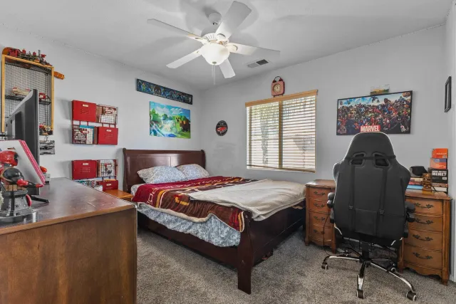 a bedroom with bed and a window