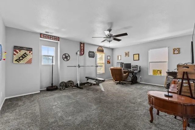 a room with gym equipment and a window