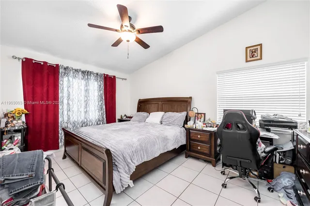 a bedroom with a bed and furniture