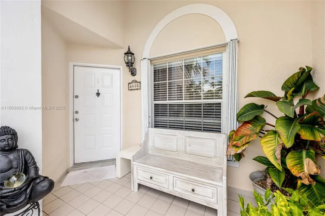 a bathroom with a granite countertop sink a mirror and a shower