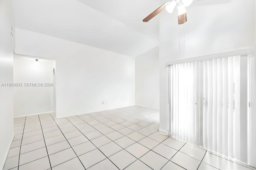 6410 Southwest 112th Place Miami, FL 33173 - Photo 4 of 19 a view of an empty room and window