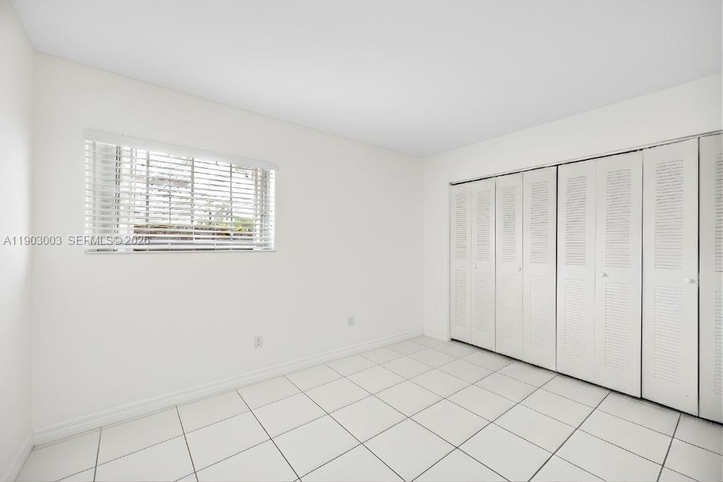 6410 Southwest 112th Place Miami, FL 33173 - Photo 10 of 19 a view of an empty room and window