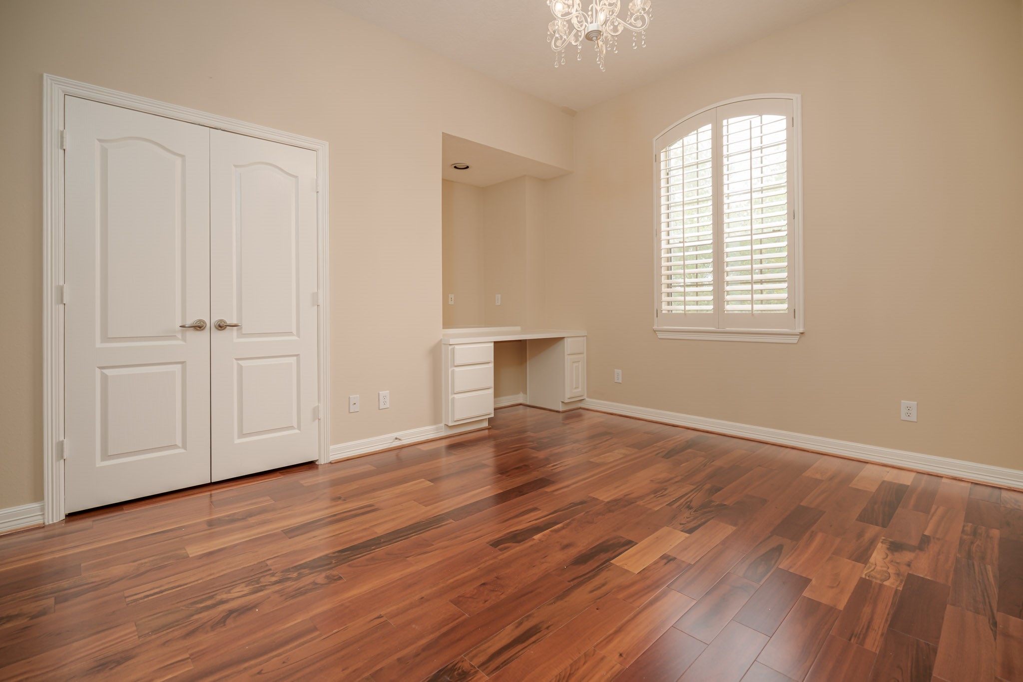 6506 Monte Bello Ridge Lane Houston, TX 77041 - Photo 15 of 39 Experience the elegance of Upstairs Bedroom #2, featuring stunning hardwood floors that enhance its warm and inviting atmosphere.