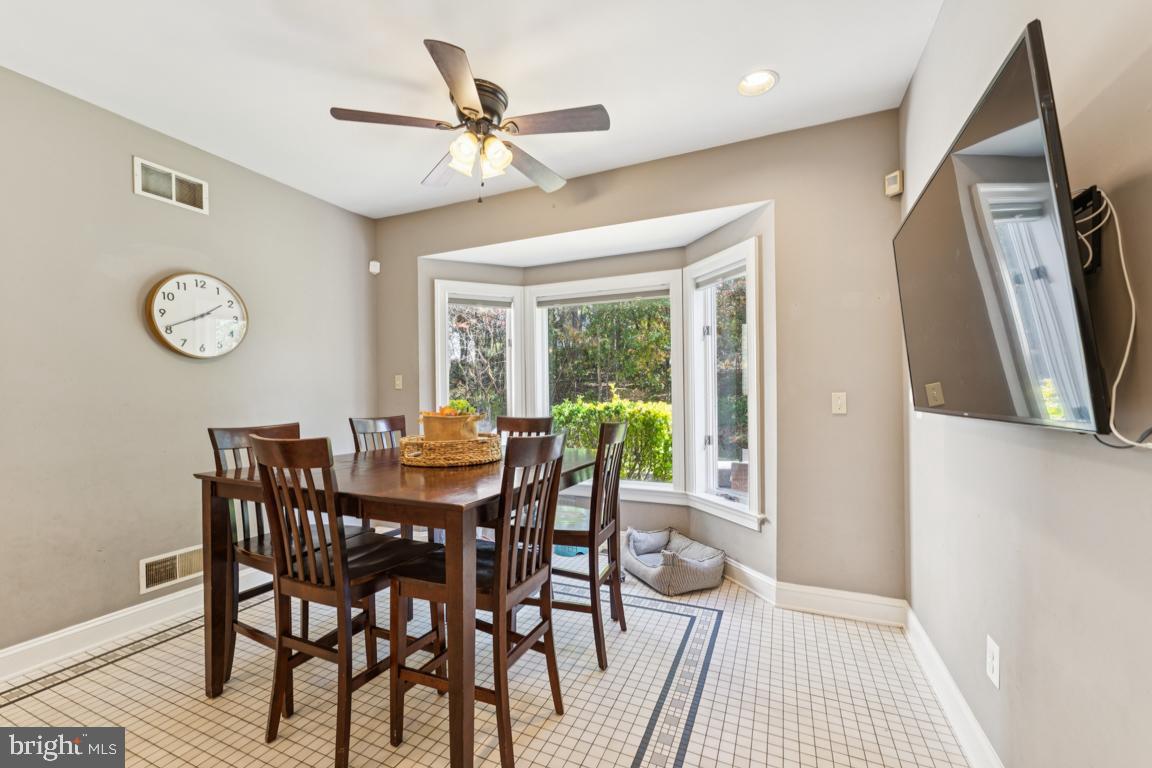 1230 Allview Drive Hampstead, MD 21074 - Photo 11 of 30 a view of a dining room with furniture window and wooden floor