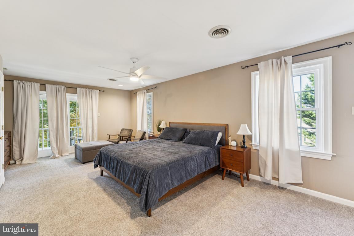 1230 Allview Drive Hampstead, MD 21074 - Photo 12 of 30 a bedroom with a bed lamp and window