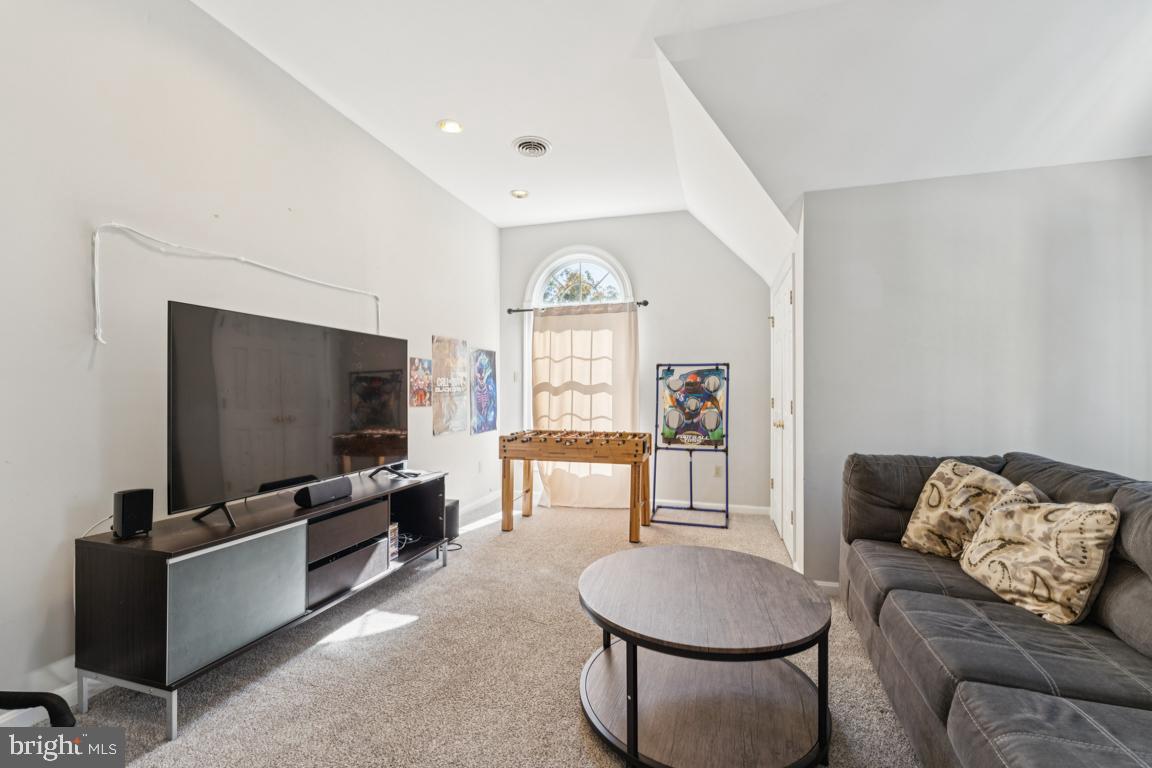 1230 Allview Drive Hampstead, MD 21074 - Photo 19 of 30 a living room with furniture and a flat screen tv