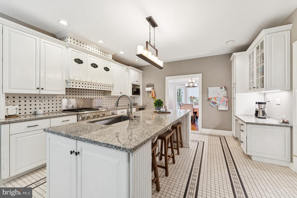 1230 Allview Drive Hampstead, MD 21074 - Photo 9 of 30 a kitchen with stainless steel appliances granite countertop a stove and cabinets
