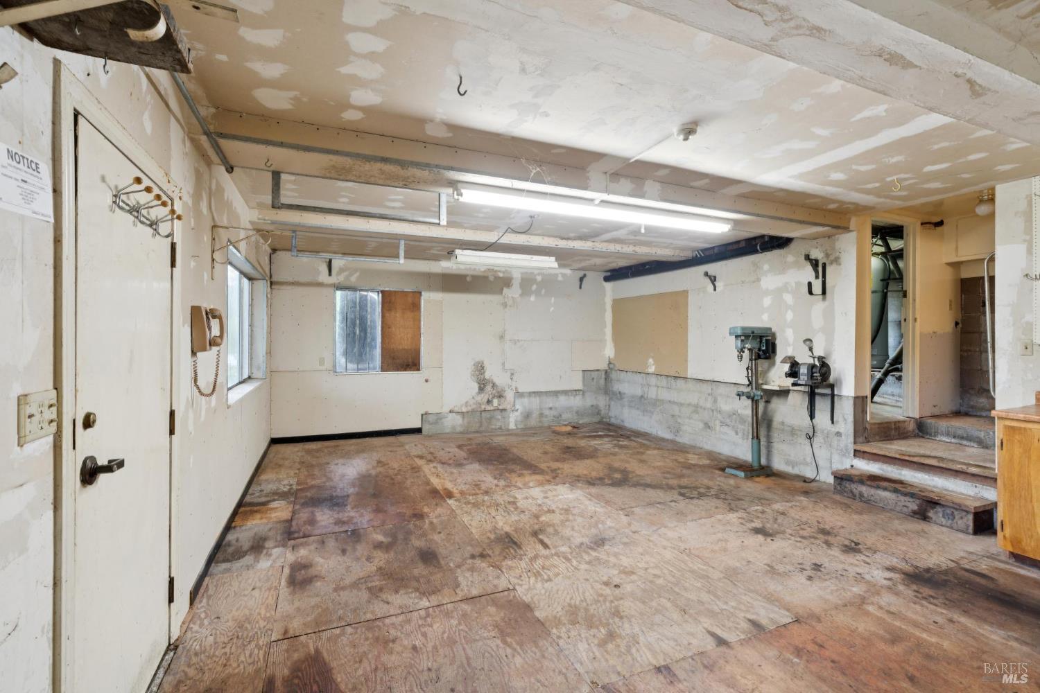 14595 Drake Road Guerneville, CA 95446 - Photo 14 of 25 a view of a hallway with closet and chandelier