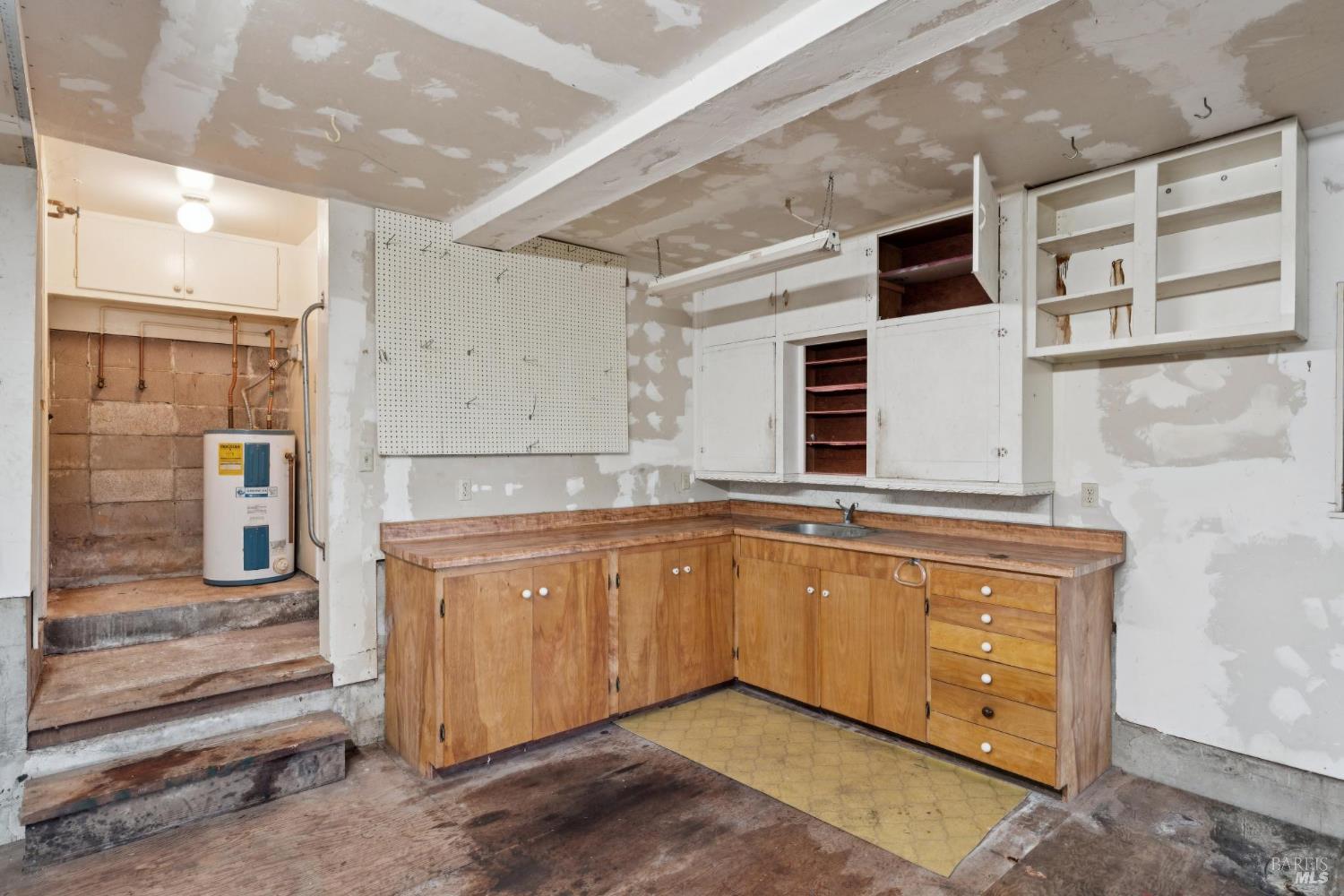 14595 Drake Road Guerneville, CA 95446 - Photo 15 of 25 a spacious bathroom with a granite countertop sink and mirror