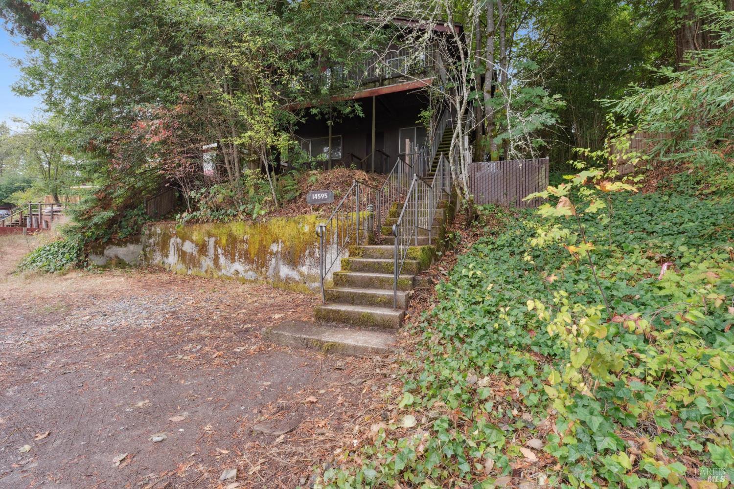 14595 Drake Road Guerneville, CA 95446 - Photo 18 of 25 a front view of a house with a yard
