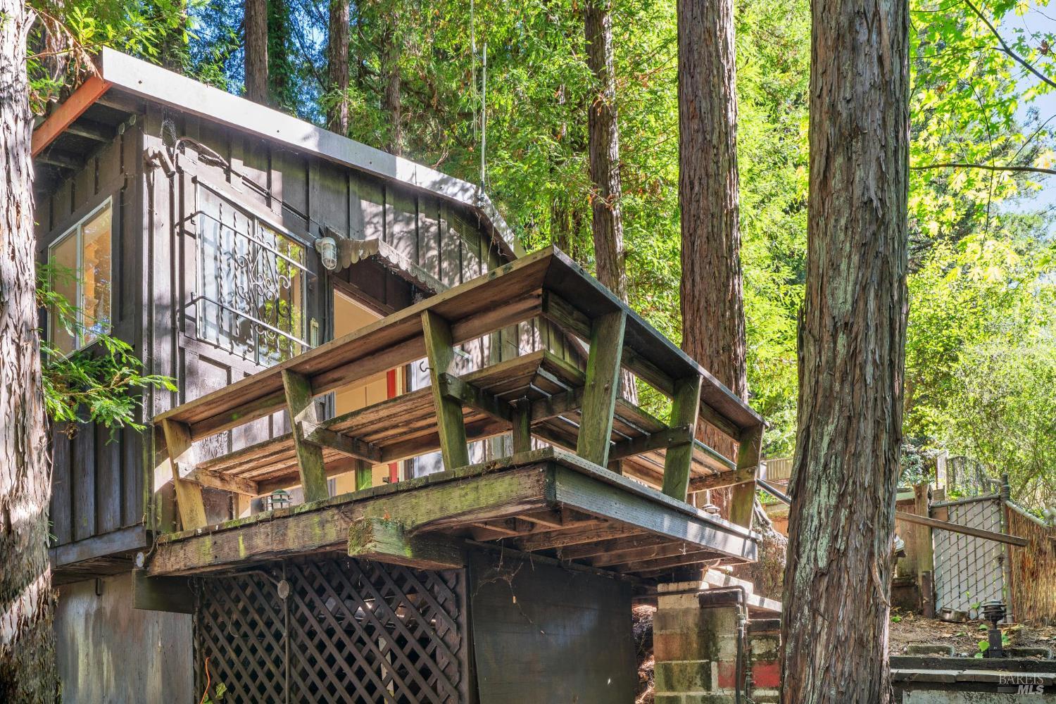 14595 Drake Road Guerneville, CA 95446 - Photo 2 of 25 a view of a house with a tree in the background