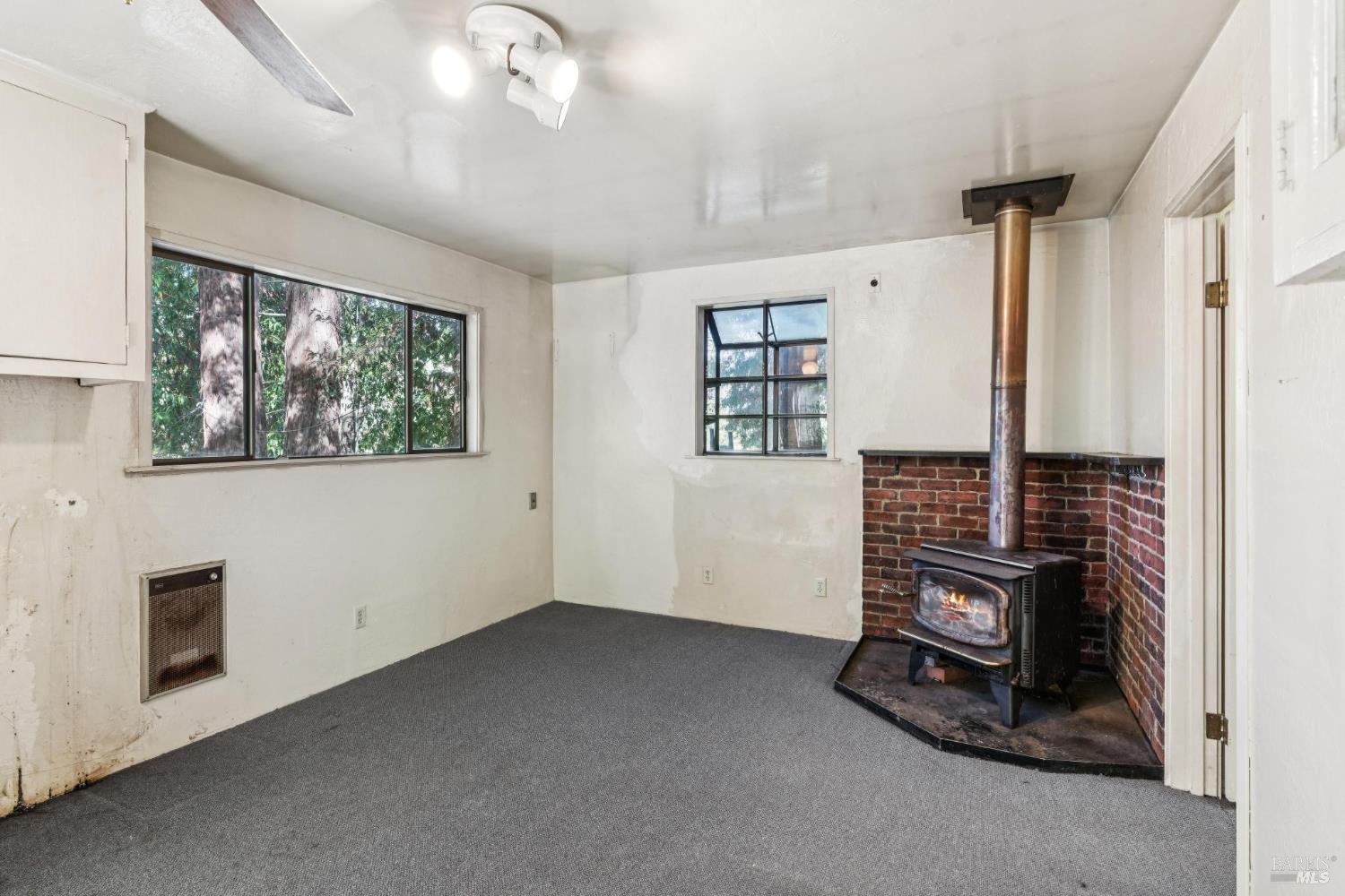 14595 Drake Road Guerneville, CA 95446 - Photo 7 of 25 a view of an empty room with a window